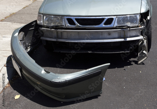 Front end bumper damage on automobile.