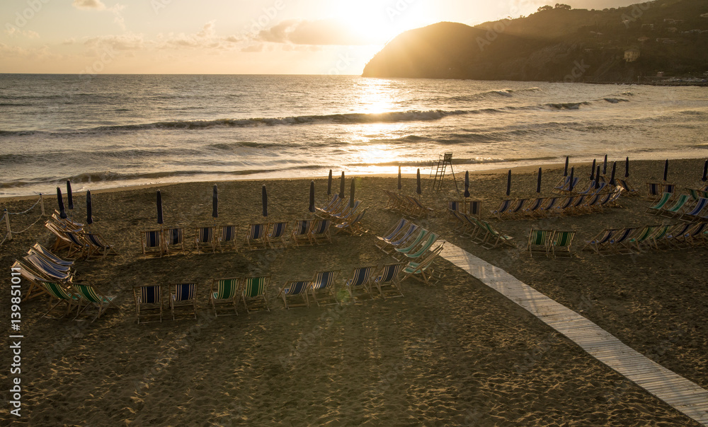 Obraz premium Scenic summer sunset over beach in Levanto, Italy