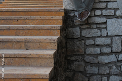 Vászonkép man whose foot on old, stone marble limit