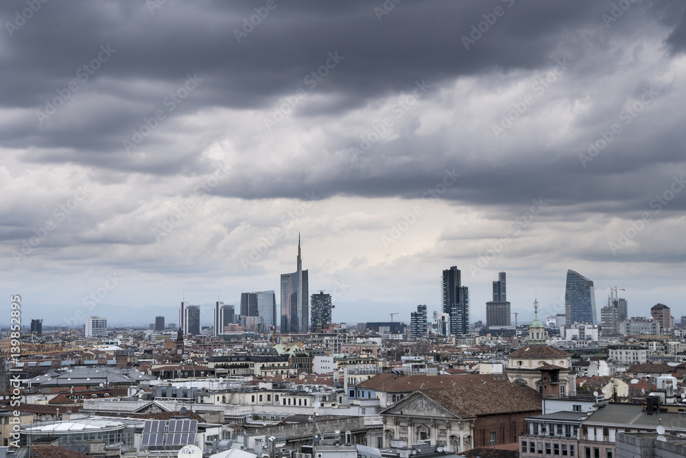 Milan panoramic skyline with new modern skyscrapers in Porta Nuova business district in Milan, Italy. The picture was taken from the roof of Duomo cathedral.