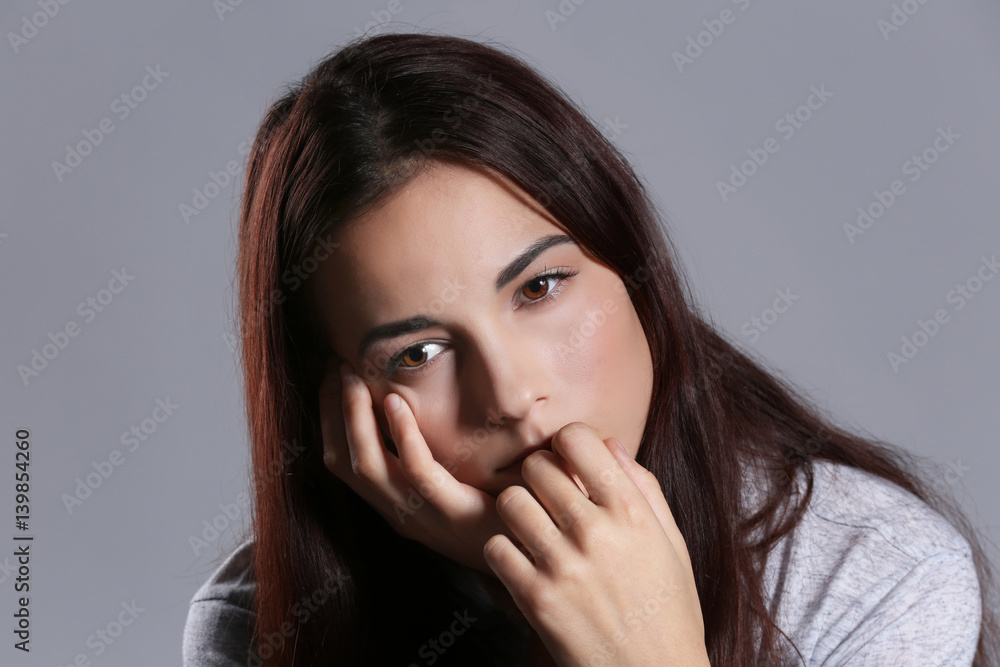Depressed young woman on color background, closeup Depressed young woman on color background, closeup