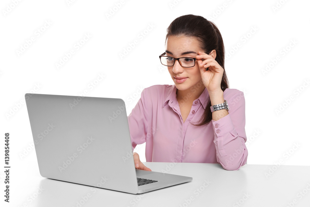 Beautiful young woman working with laptop, on white background Beautiful young woman working with laptop, on white background