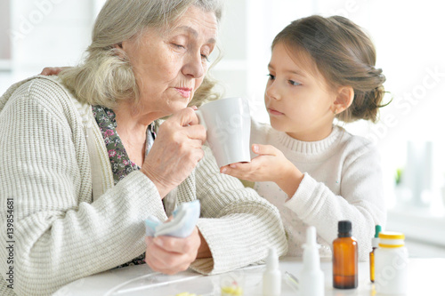 Granddaughter takes care of a sick grandmother