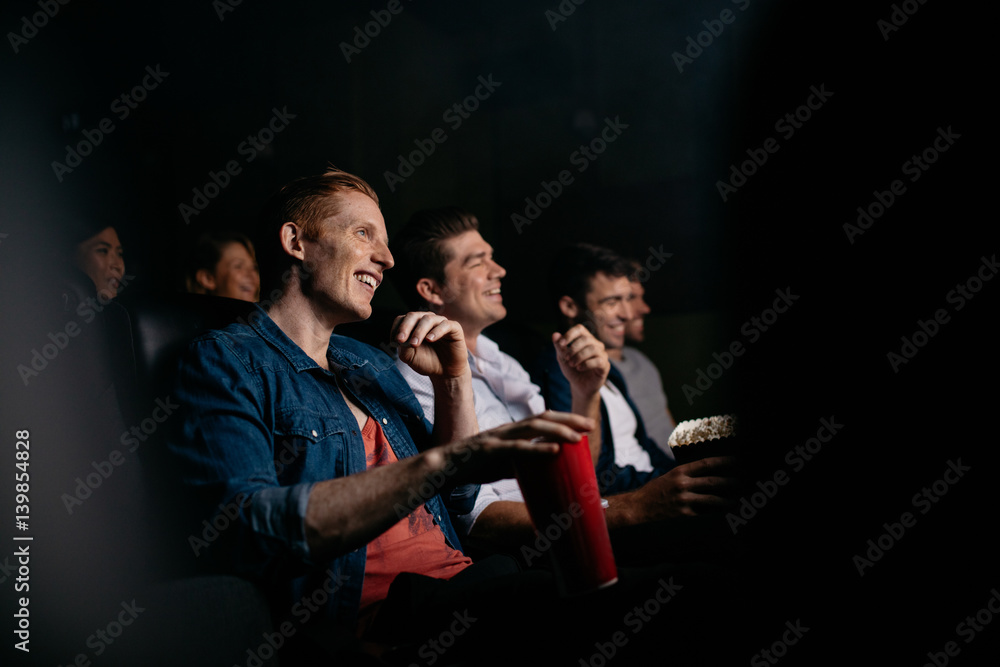 Group of people watching movie in theater - obrazy, fototapety, plakaty 