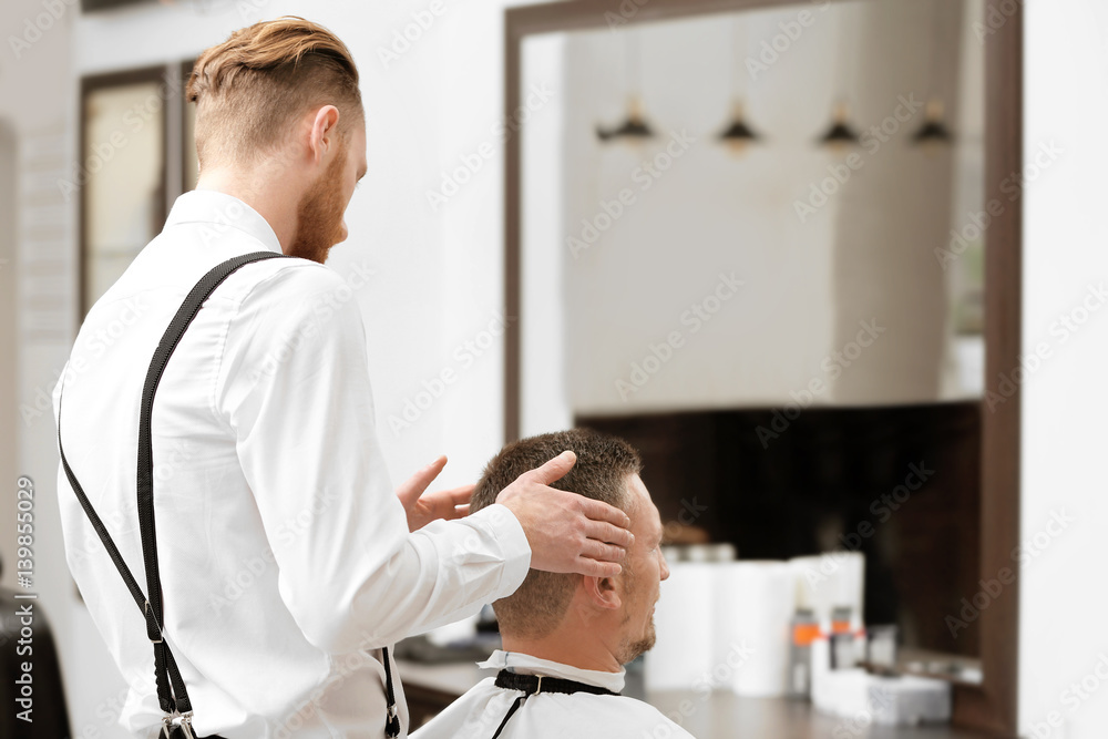 Fototapeta premium Barber making modern male hairstyle
