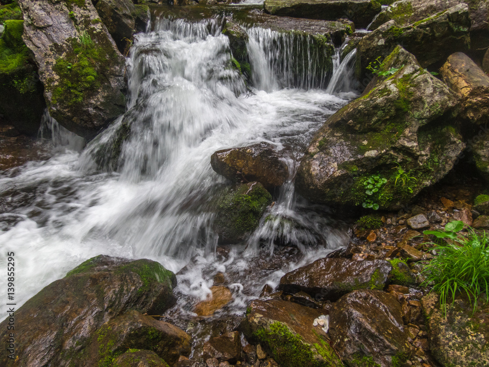 Big waterfall in green stone