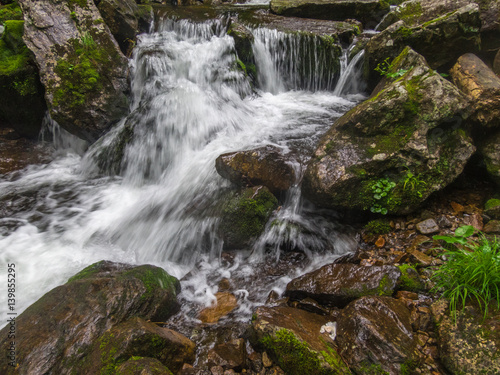 Fototapeta Naklejka Na Ścianę i Meble -  Big waterfall in green stone