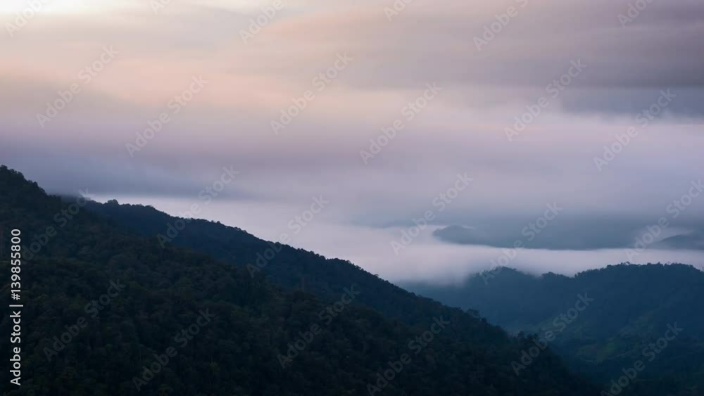 Time Lapse - Clouds Moving over Mountain valley at Sunrise. Time Lapse - Clouds Moving over Mountain valley at Sunrise.