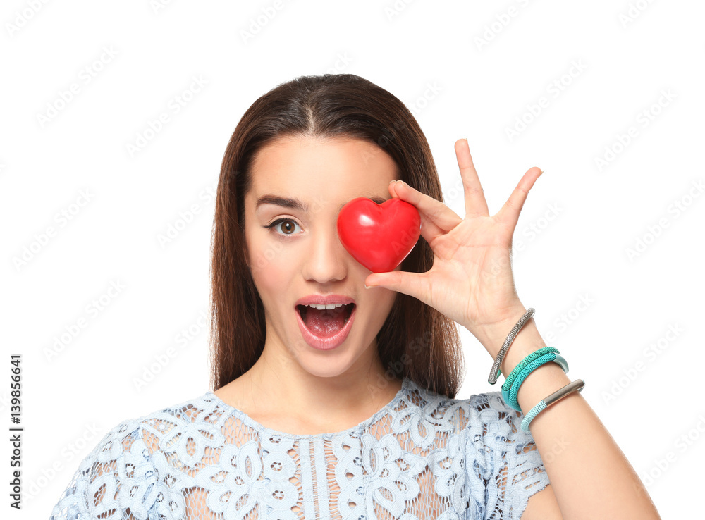 Beautiful young woman with small red heart on white background Beautiful young woman with small red heart on white background