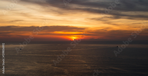 Beautiful sunset above the sea.  Scenic view of beautiful sunset above the sea