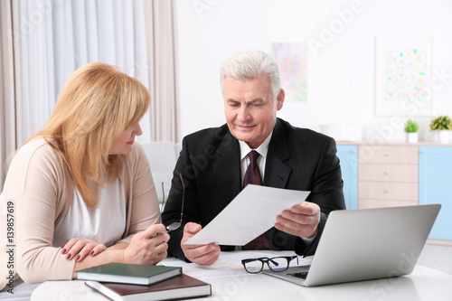 Mature woman at notary public office