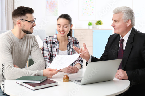 Young couple at notary publ...