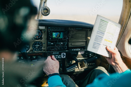 Flight instructor and student reviewing flight checklist