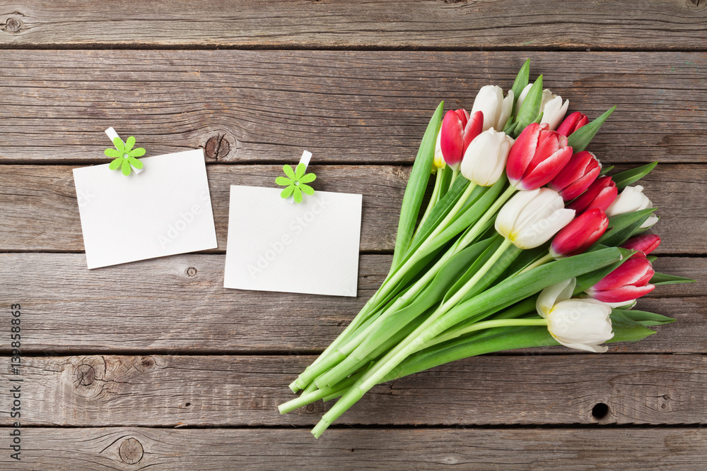 Fresh tulip flowers bouquet and photo frames Fresh tulip flowers bouquet and photo frames