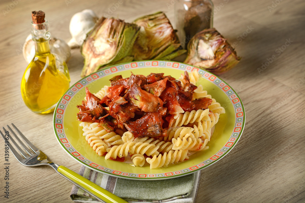 Fototapeta premium pasta with tomato sauce and artichokes