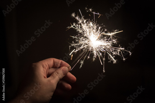 Hand holding sparkler