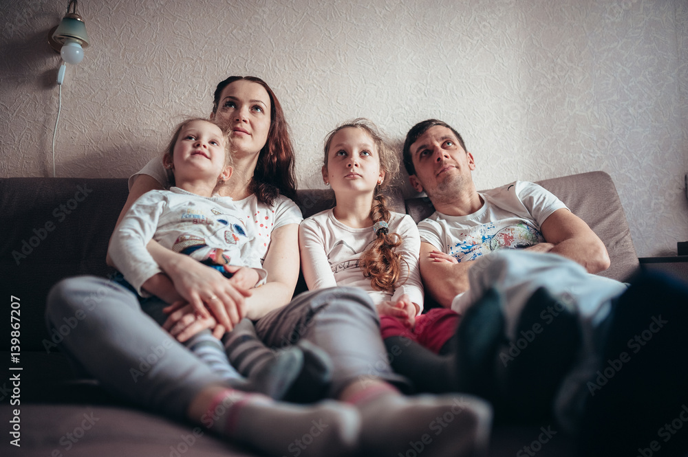 The Family Is Sitting On The Couch And Watching TV Stock Photo Adobe   1000 F 139867207 HjlmrPlx1tXcN76rUe59J6R2wdD87sLf 