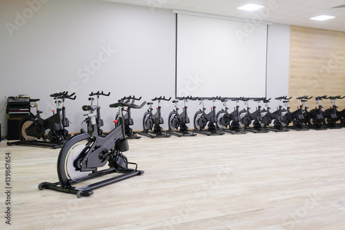 Unterior of a fitness hall with sport bikes