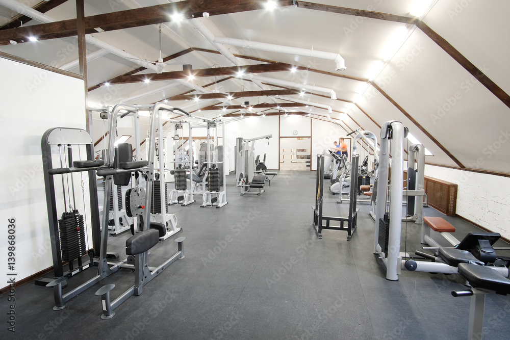 Fototapeta premium Fitness hall with fitness machines