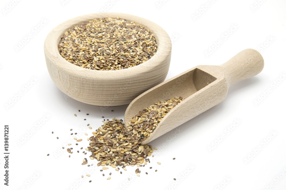 Flax, chia and sesame seeds in wooden scoop and bowl Flax, chia and sesame seeds in wooden scoop and bowl