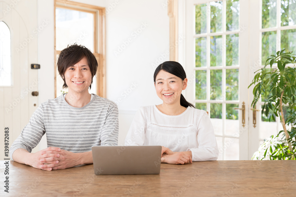 young asian couple using laptop computer young asian couple using laptop computer
