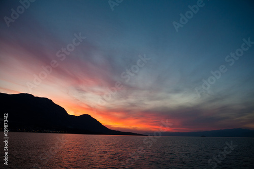 Greek sunset from sailboat © Adam