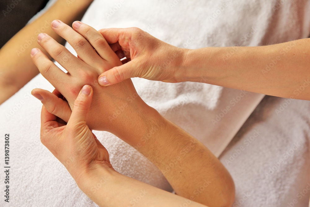 Hand massage with white towel, spa salon Hand massage with white towel, spa salon