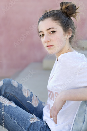 Portrait of teenage girl sitting