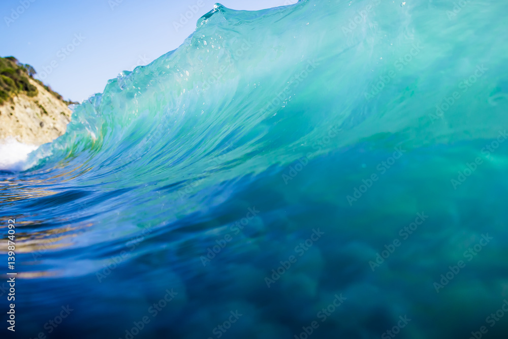 Beautiful blue wave in ocean. Clear wave and sun light Beautiful blue wave in ocean. Clear wave and sun light
