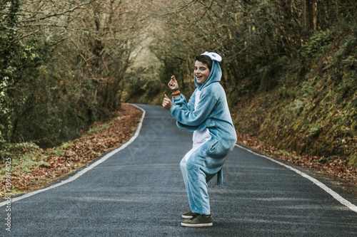 child dressed up as dancing and playing outdoors