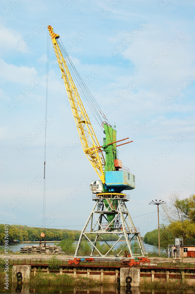 Cargo crane in abandoned river harbor