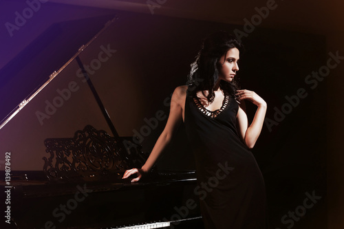 Beautiful woman posing near...