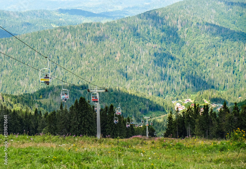 Sky lift on mountain hills background