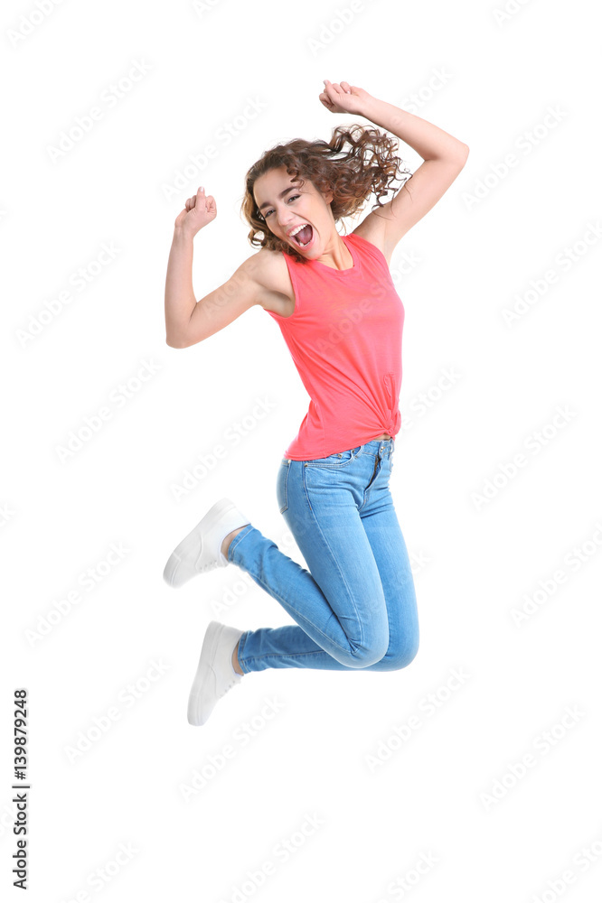 Joyful young woman jumping on white background