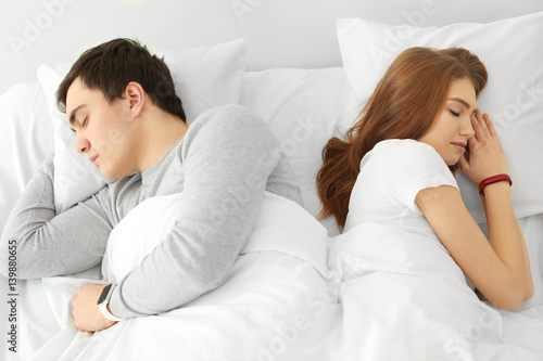 Young couple with sleep tra...