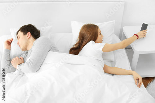 Young couple with sleep tra...