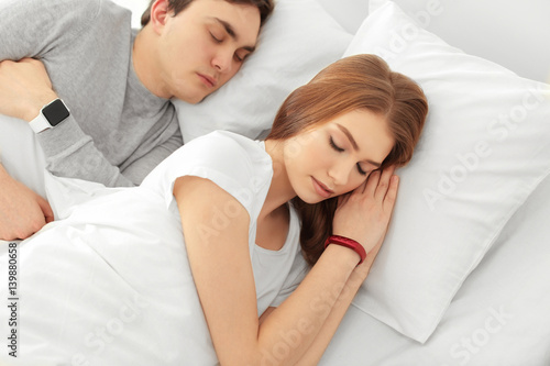 Young couple with sleep tra...
