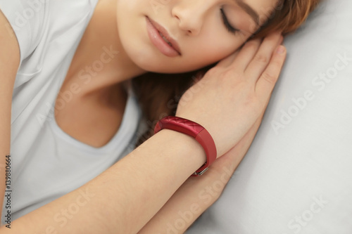 Young woman with sleep trac...