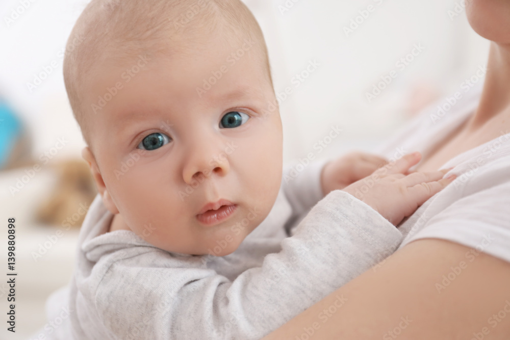 Young woman with cute little baby at home, closeup Young woman with cute little baby at home, closeup