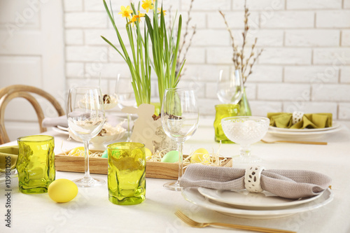 Beautiful Easter table setting with green glasses