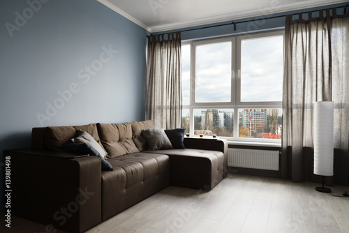 Clean family room with brown couch