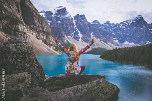 Woman on the top of the mountains photo