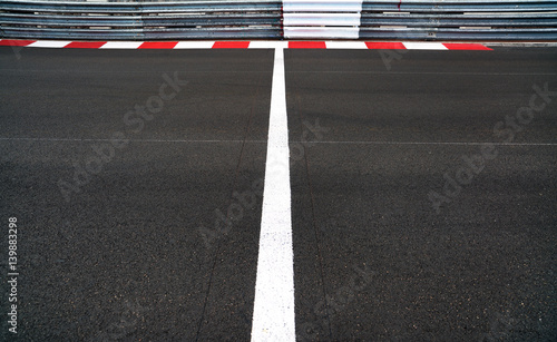 Start and Finish line in motor race asphalt Grand Prix track and guard rail or guardrail © stevanzz