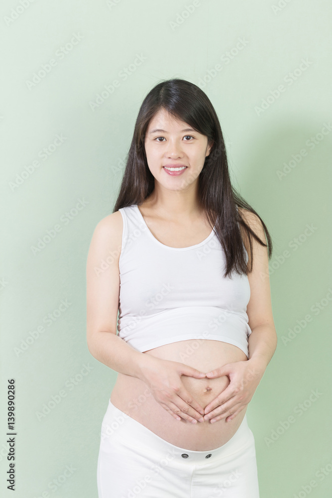 young pretty woman holds her belly young pretty woman holds her belly
