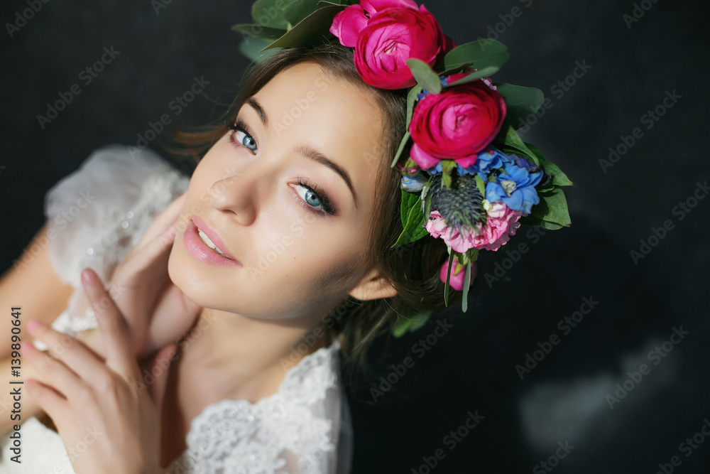 woman face with blue eyes . beauty bride on the dark background