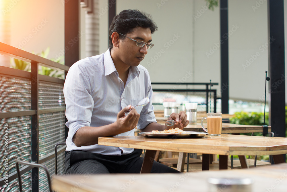 asian business man having roti canai outdoor asian business man having roti canai outdoor