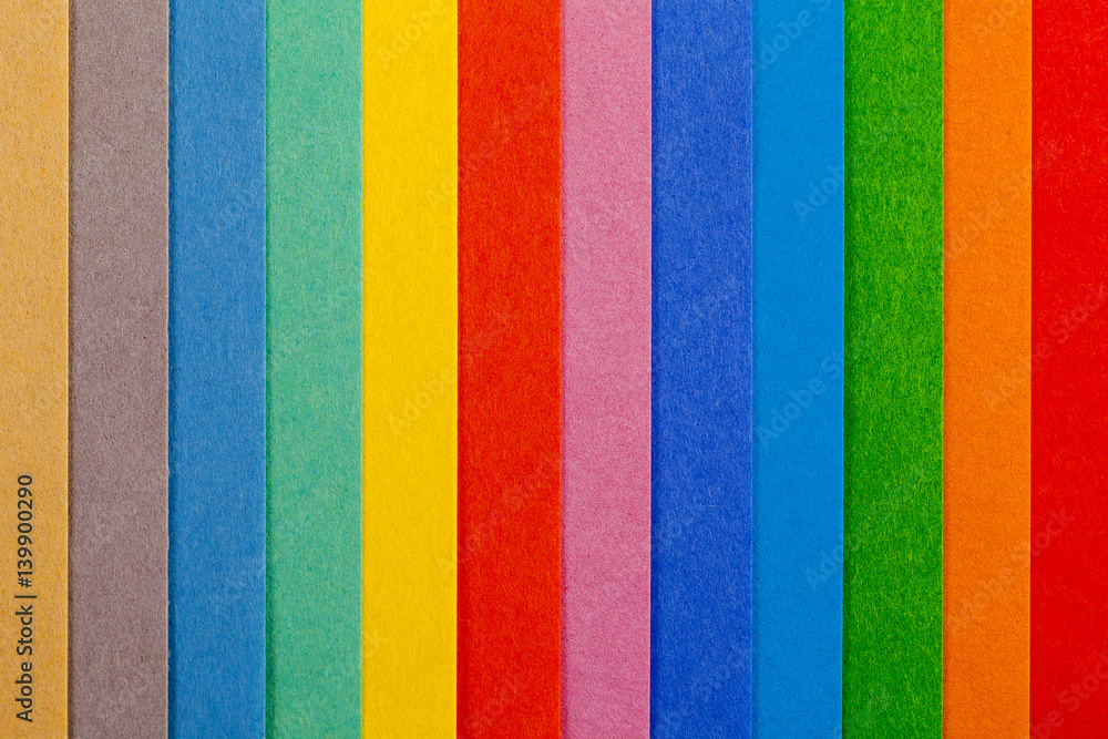 Background of colorful paper parallel vertical stripes Background of colorful paper parallel vertical stripes