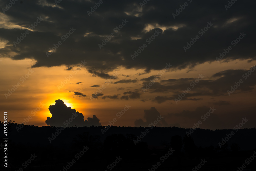Silhouette cloud and mountain with sunset sky.