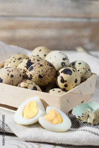 Quail eggs in wooden box, Easter concept, diet meal