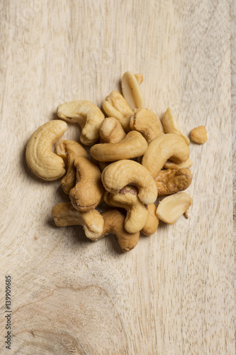 closeup of cashew nuts on wooden background